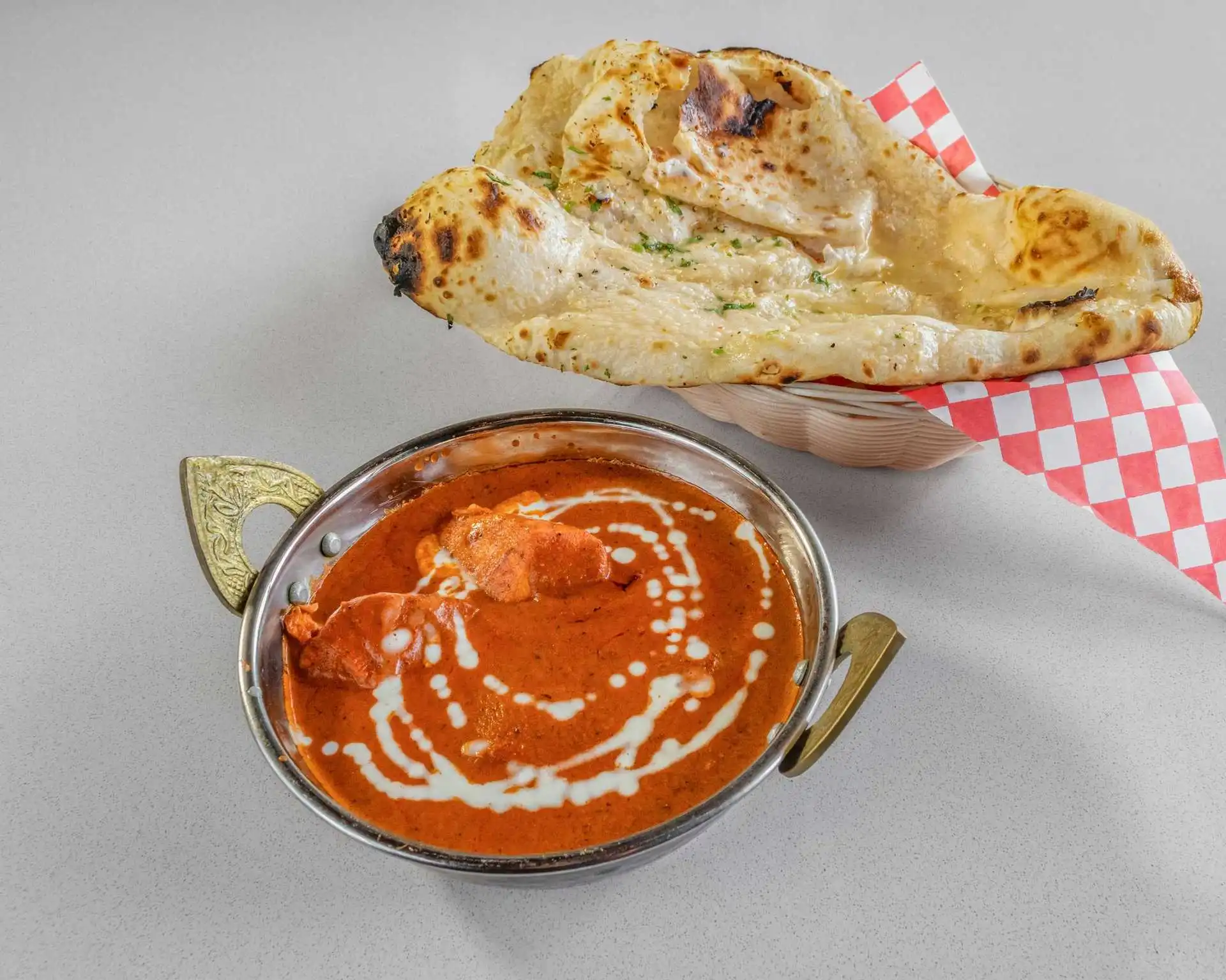 Butter chicken in creamy tomato sauce at Kirat Dhaba Winnipeg